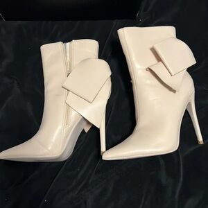 Fashion Nova Cream Heeled Boots with Bow Detail